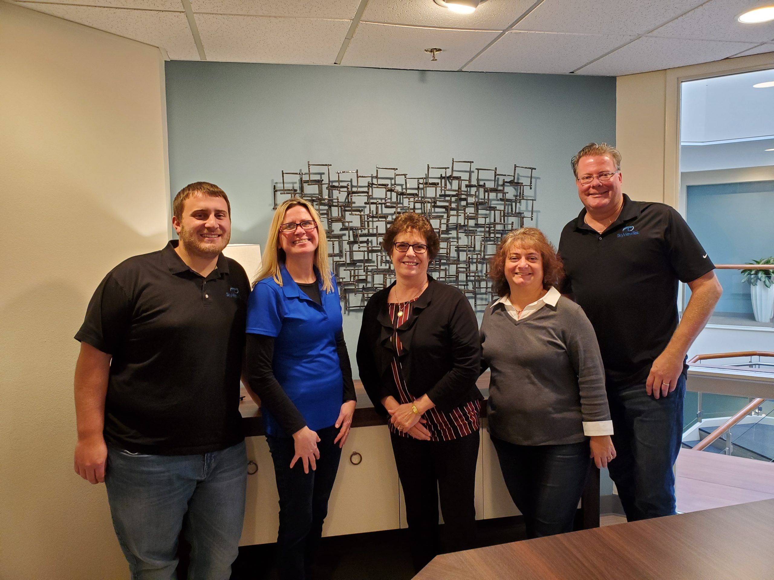 SkyViewTek Team - Pictured from left to right: Eric Gibbs, Susan Dykas, Kitsi Cox, Andrea Blenk, and Bernie Orglmeister SkyViewTek Team - Pictured from left to right: Eric Gibbs, Susan Dykas, Kitsi Cox, Andrea Blenk, and Bernie Orglmeister