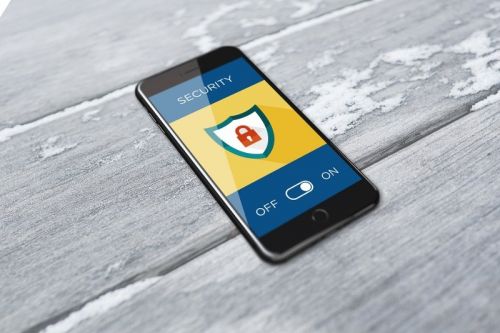 smart phone with a security symbol on the front screen- Cyber Security Company Helping Small Business - SkyViewTek