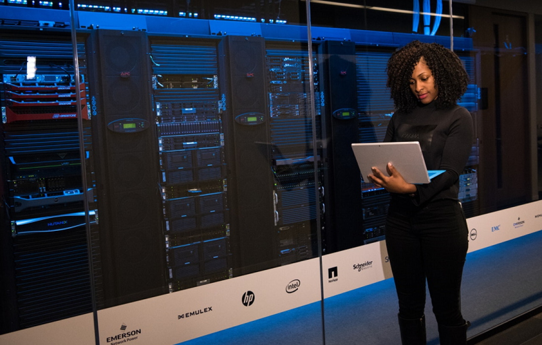 Woman Standing Beside Computer Network System - Secure email, spam and compliance archiving management - SkyViewTek