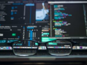 Reading glasses sitting on table in front of a computer | Computer Network Set Up and Design | SkyViewTek